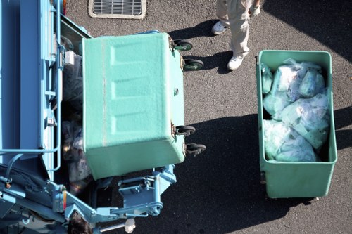 Volunteers receiving donated furniture from a house clearance