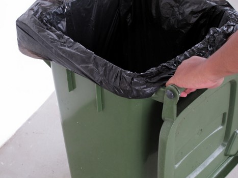 Investigator reviewing evidence during a waste clearance complaint